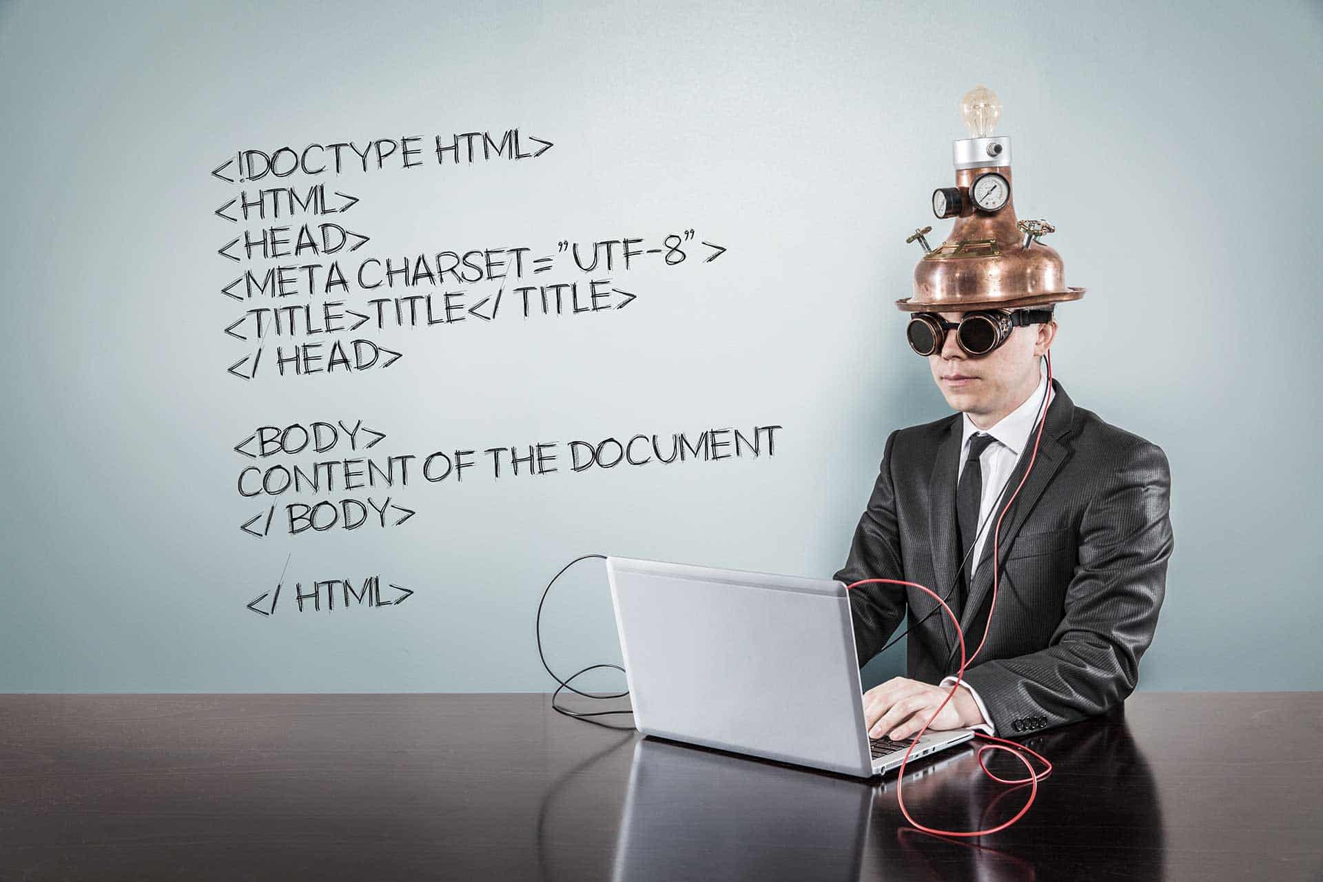 mad scientist analyzing html Man with device on his head at computer working